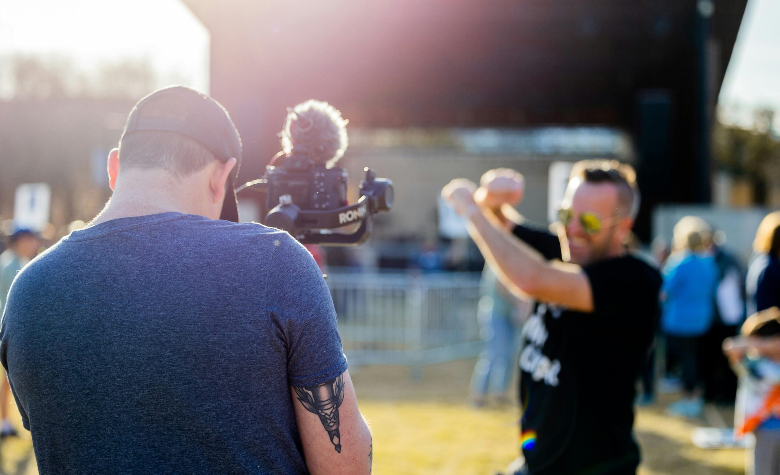 Videographer filming outdoor event