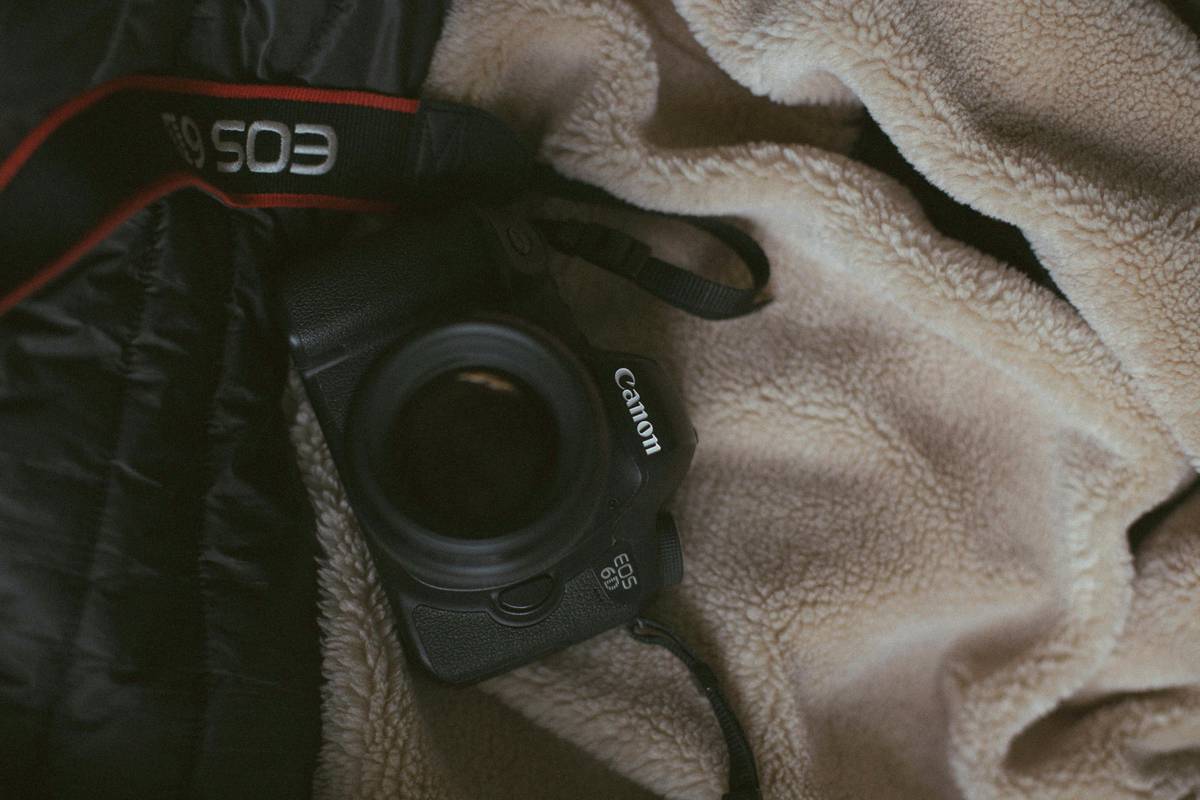 A DSLR camera secured inside a padded travel case